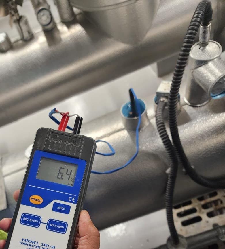 Temperature measurement on HVAC pipework during commissioning.